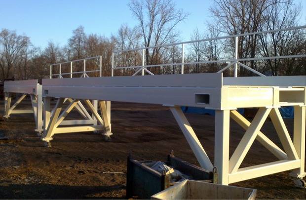Elevated work platform with railings
